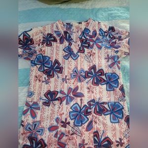 Womens small scrub top with white, red, and blue flowers